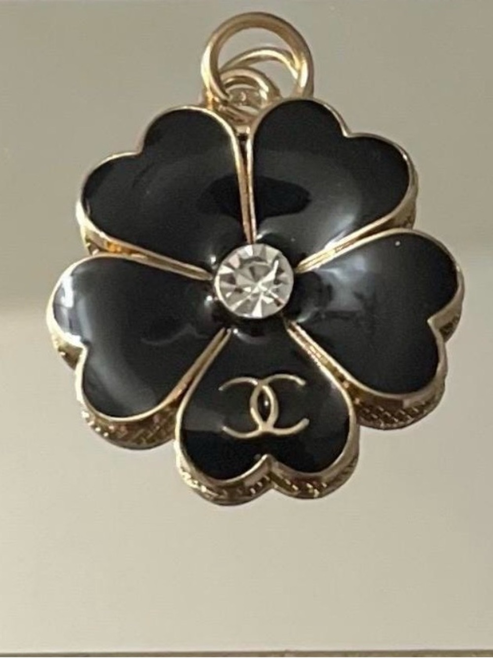 CHANEL Black Enamel Four-Leaf Clover pendant with Crystal Accent